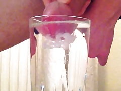 Cumming into a glass of water