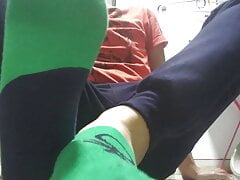 Green sweaty socks and dirty feet after work