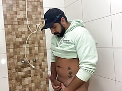 Bearded in the bathroom playing with his Big Cock until he cums and spreads sperm