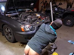 Slutty mechanic in the shop with a plug in his ass
