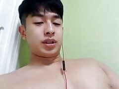 Cute asian guy showing on cam