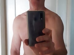 Wanking in front of mirror with handy