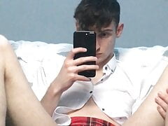 Twink dressed in schoolgirl outfit plays with his hole